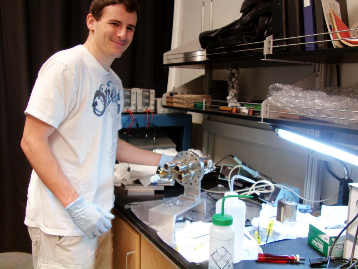 Munir poses with his research equipment