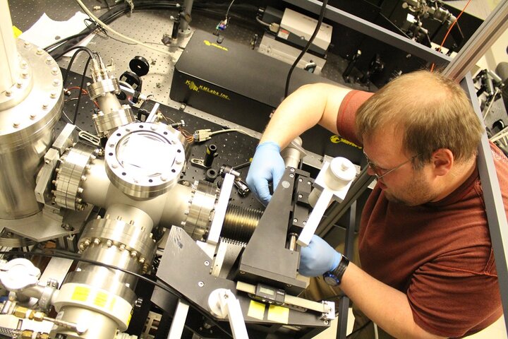 Evan Brunkow working on the spin-polarized femtosecond polarized electron source.