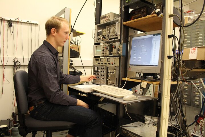 Matt adjusts a knob at his Console. 