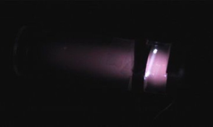 The laser being absorbed and re-emitted by an Argon discharge.