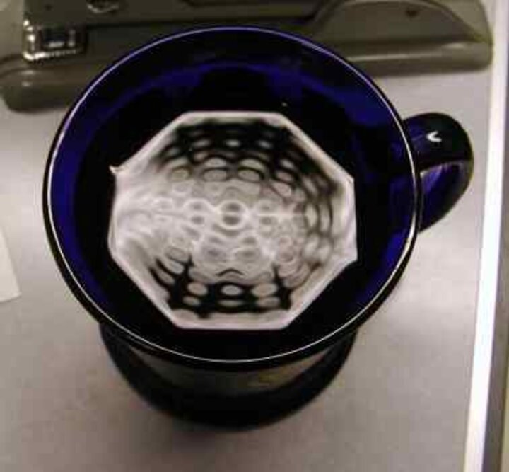 The vibrations as seen in JB's coffee cup. Note how the shape of the cup creates distinct wave patterns, much like electrons in a quantum corral.